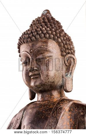 Buddha Shakyamuni's figure in a manual pose - vitarka mudra. The old statue made of metal isolated on a white background.