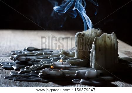Blue smoke with candls on black background