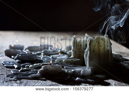 Blow off candles with smoke on black background
