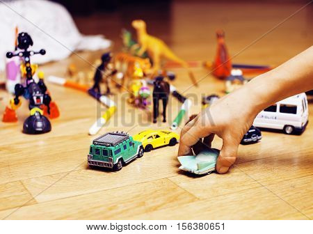children playing toys on floor at home, little hand in mess, free education, lifestyle people concept