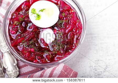 Bowl of beetroot soup with sour cream and eggs