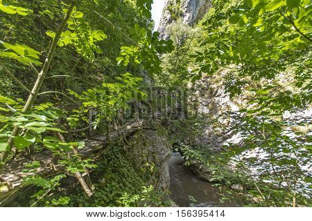 Wooden bridge over river, Erma River Gorge, Bulgaria
