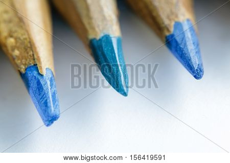 Colored pencils sharpened by hand closeup. Selective focus