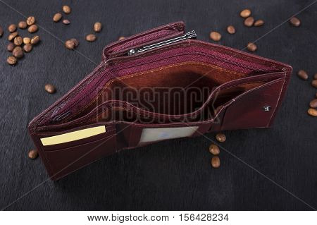 Brown women's purse on a wooden background