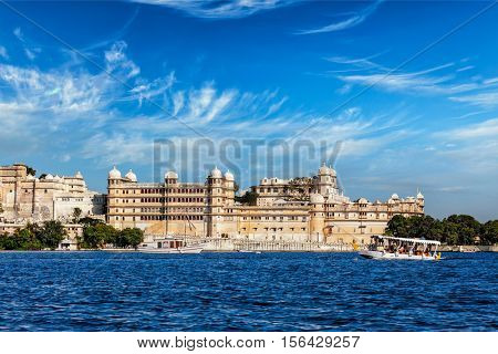 India luxury tourism concept background - Udaipur City Palace from Lake Pichola. Udaipur, Rajasthan, India