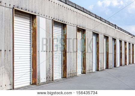 Self Storage Unit Shutter door or roller door of factory building use for industrial background.