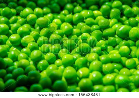 a lot of green peas. green balls of pea pod
