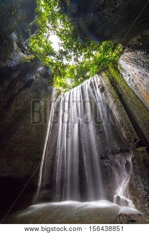 Beautiful secret Tukad Cepung Waterfall in Bali, Indonesia. Long exposure shot