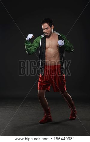 Muscular Asian Male Boxer Training Uppercut Punching