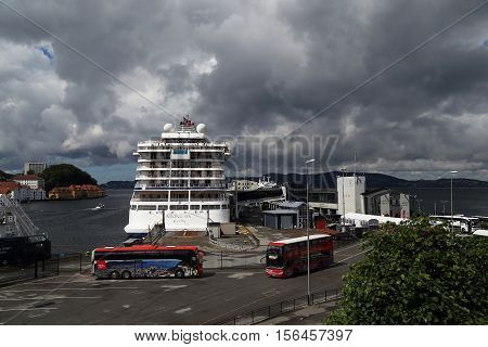 BERGEN, NORWAY - JULY 3, 2016: This is one of the cargo and passenger sea berths town near the castle Bergenhus.