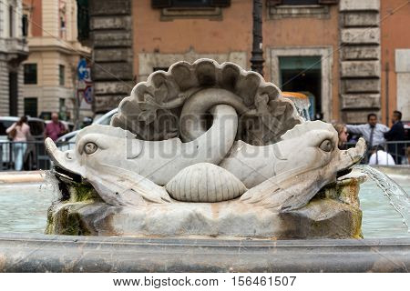ROME, ITALY - JUNE 13, 2015: The fountain in the piazza Colonna. Rome Italy