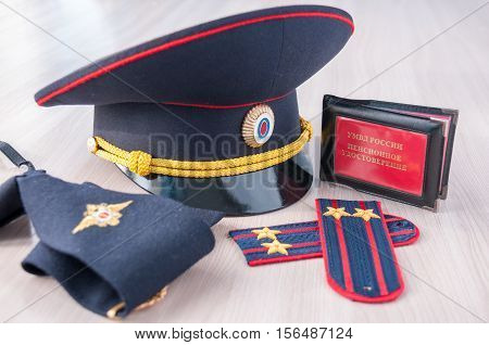 Pension certificate AMIA Russian next to the police cap