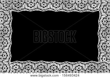 White lace as a frame on black background