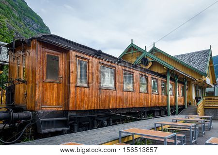 Retro wooden railway carriage at station of Flamsbana - famous old mountain railway in Flam, Norway.