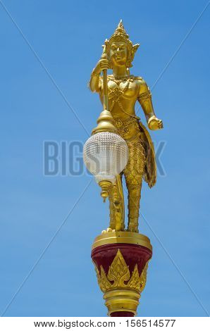 Thai kinaree mythology is a half woman and bird decorated in the lighting pole against blue sky.