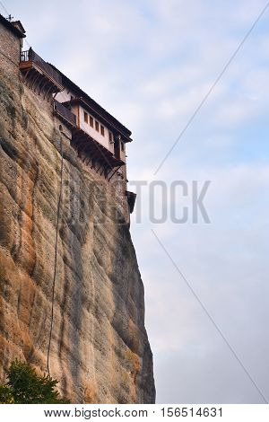 View from bottom on the Monastery Roussanov at sunrise Meteora Greece