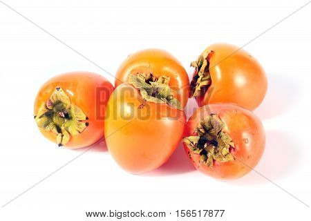 pile of ripe fresh tropical fruit persimmon prepared for eating
