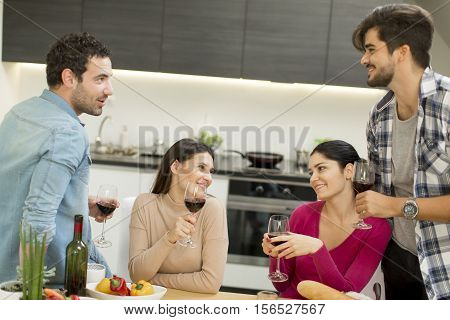 Young People Sitting By The Table
