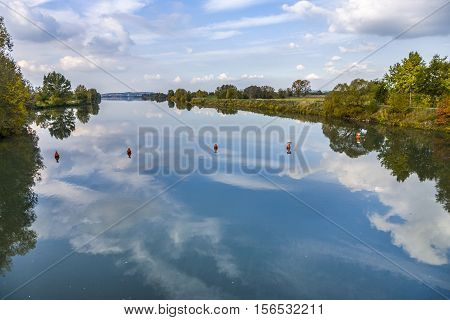 reflection of trees in river tauber, in Bavaria, Germany