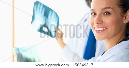 Doctors analyzing an x-ray in a meting