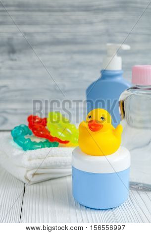 baby organic cosmetic for bath on wooden bakground close up
