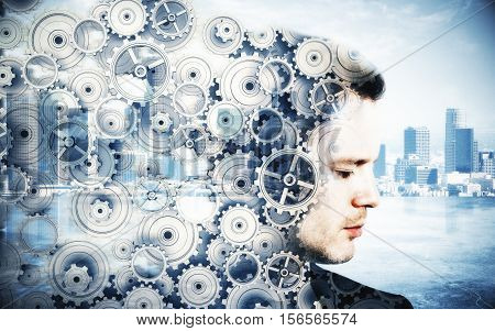 Side portrait of young man with cogwheels on city background. Brainstorming concept. Double exposure