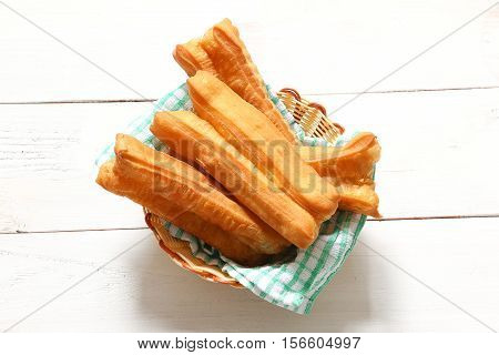 Chinese traditional Fried bread stick or popular known as You Tiao normally eaten with rice porridge or spread with butter and coconut jam