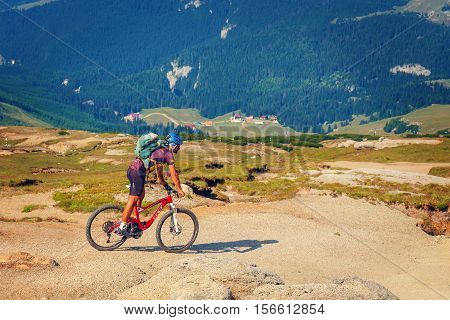 Bucegi Mountains, Romania July 09, 2015: Unidentified Biker Climbs The Hill In Bucegi Mountains In R