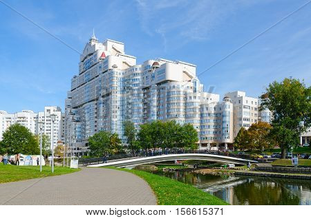 MINSK BELARUS - OCTOBER 1 2016: Humpback bridge over Svisloch and residential complex 