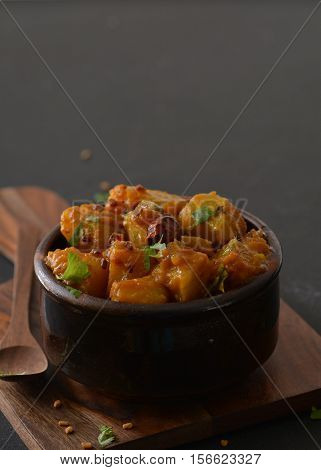 Sweet and sour Yellow Pumpkin curry cooked in Indian style