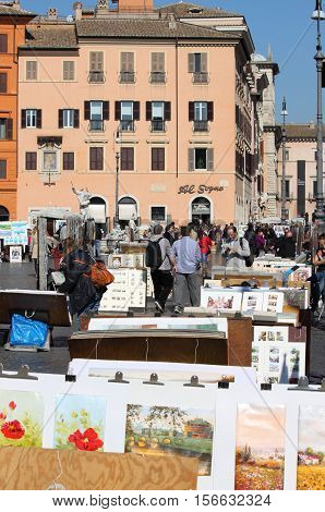 ROME - FEBRUARY 24: Tourists at Navona Square on February 24 2012 in Rome Italy. Navona Square is a popular destination in Rome the 3rd most visited city in European Union