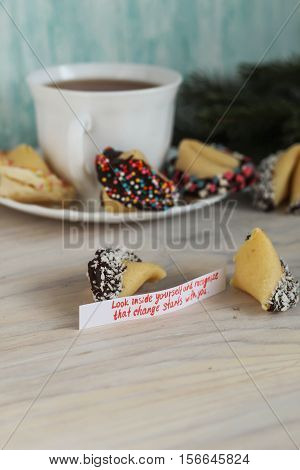 Fortune cookies decorated with chocolate look inside yourself and recognize that change starts with you