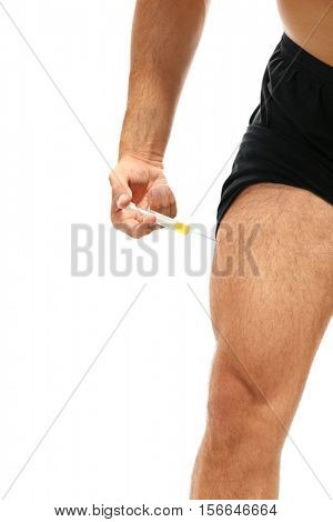 Muscular man injecting steroids, closeup