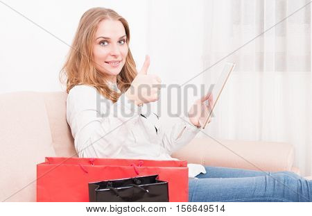 Lady Laying On Chouch Holding Tablet Showing Like