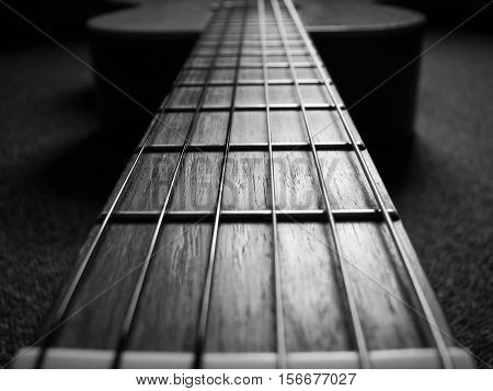 a black and white classical guitar fretboard