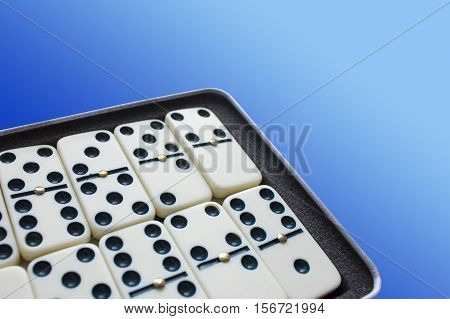 Dominoes on wooden table background. Entertainment. A game