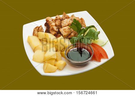 Skewers of chicken with vegetables potatoes and vegetables