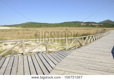 Wooden pathway at the Dunes of Corrubedo Natural Park in Galicia Spain