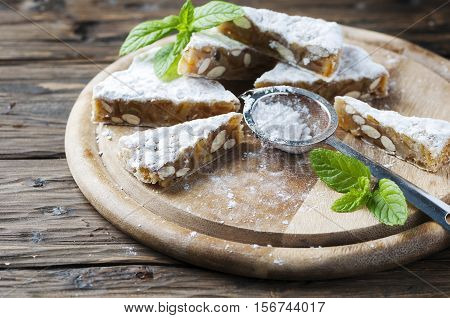 Traditional italian dessert panforte with nut selective focus