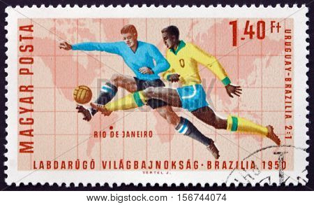 HUNGARY - CIRCA 1966: a stamp printed in Hungary shows Soccer Play Rio de Janeiro (Uruguay 2 Brazil 1) World Cup Soccer Championship 1966 Wembley England circa 1966