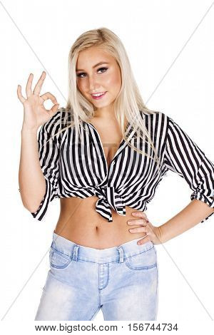 Portrait of a beautiful young blonde woman showing okey, isolated on white background