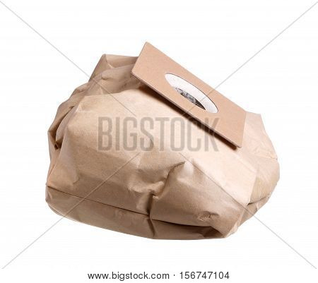 One full card board dispoable vaccuum cleaner dust bag isolated on white.