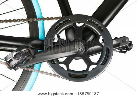 Close up of black bike crankset chainring and pedals. Isolated on white