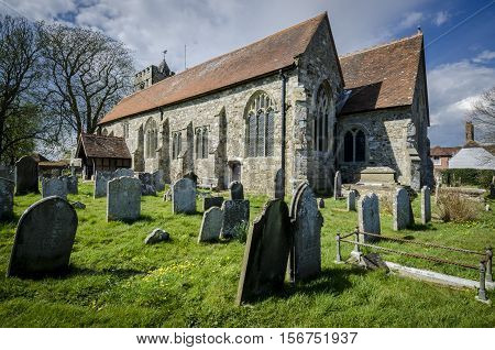Church of St George and graveyard Brede Kent UK