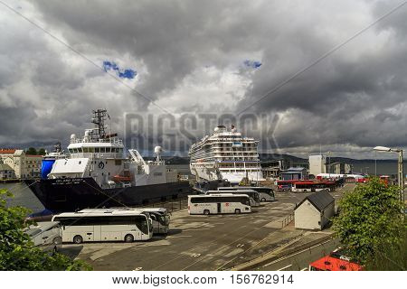 BERGEN, NORWAY - JULY 3, 2016: This is one of the cargo and passenger sea berths town near the castle Bergenhus.