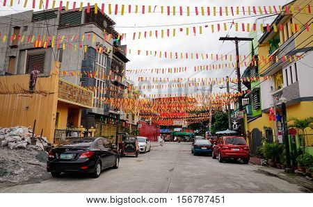 People And Vehicles On Street In In Manila, Philippines