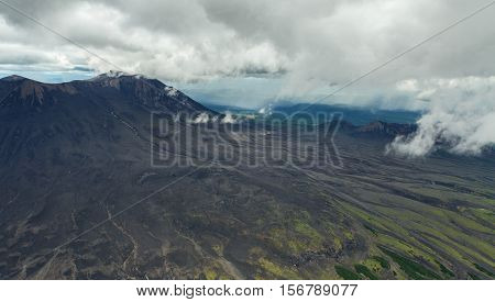 Maly Semyachik is a stratovolcano. Kronotsky Nature Reserve on Kamchatka Peninsula. View from helicopter.