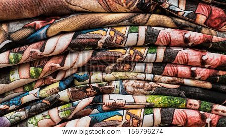 Cartoon shirts is overlay on the shelf at the store.