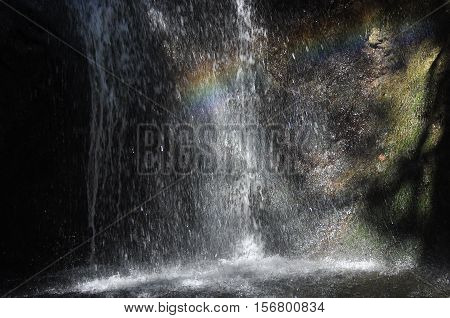 Rainbow at the waterfall Millomeris in the mountains in Cyprus