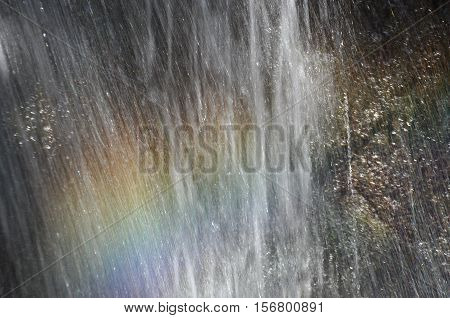Rainbow at the waterfall Millomeris in the mountains in Cyprus